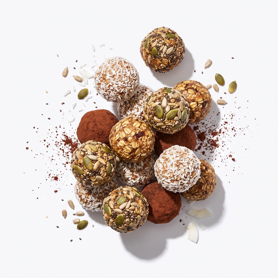 Oat and date energy balls rolled in seeds and coconut